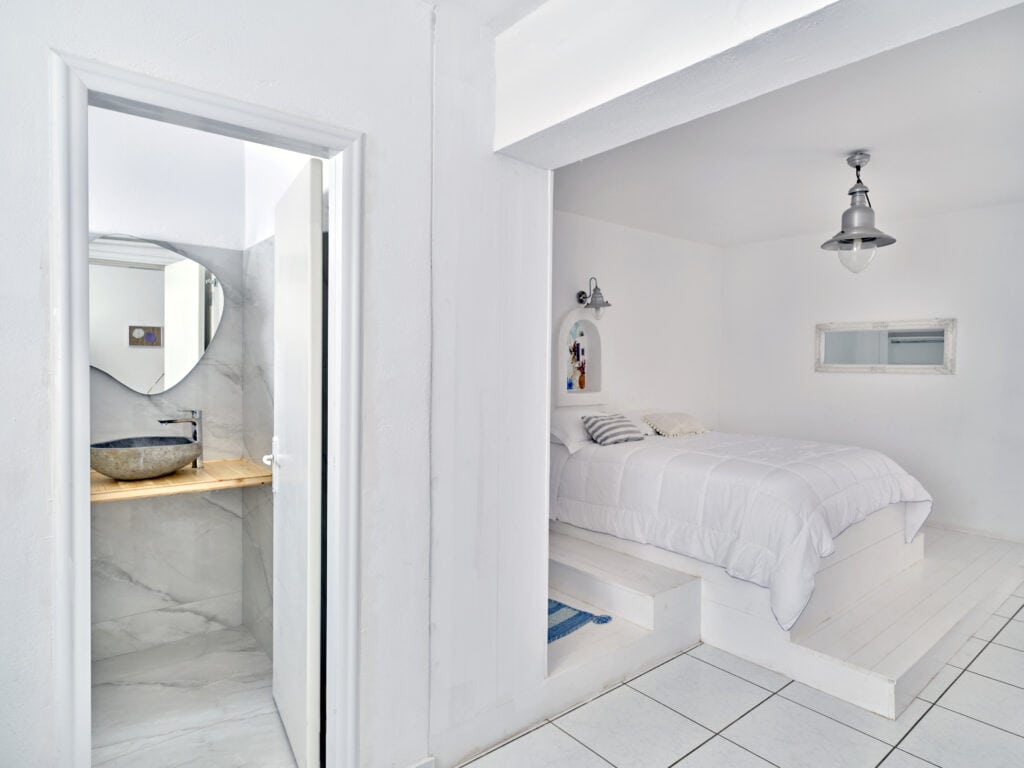 Bathroom with walk-in shower and stone sink - Cozy Family Apartment Ambelas Paros