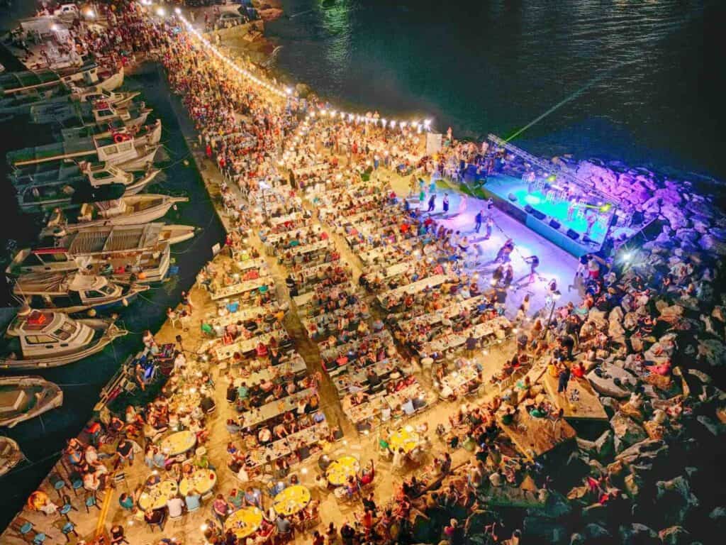 Crowd enjoying the Agios Fanourios festival in Ambelas, Paros on August 26