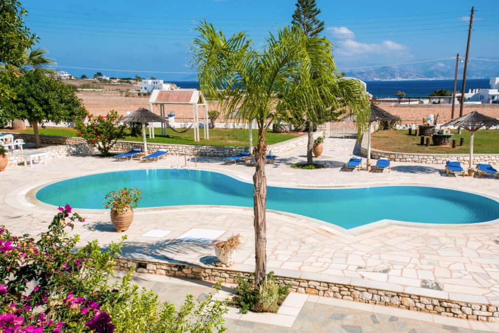Swimming pool and building exterior at Fyrogenis Palace in Ambelas, Paros