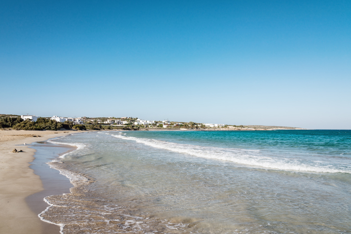 Santa Maria Beach on Paros island with clear blue water and sandy shoreline