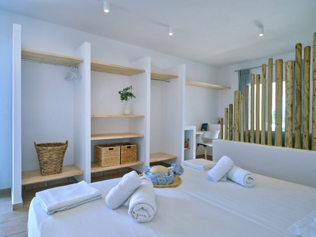 White & Blue room bedroom and sitting corner with decorative panels in Ambelas