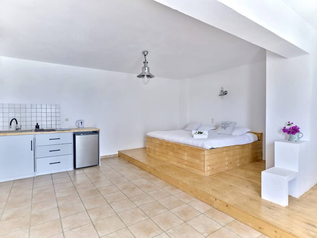 Bright White & Blue Room kitchenette and dining area - sea-view accommodation in Ambelas Paros