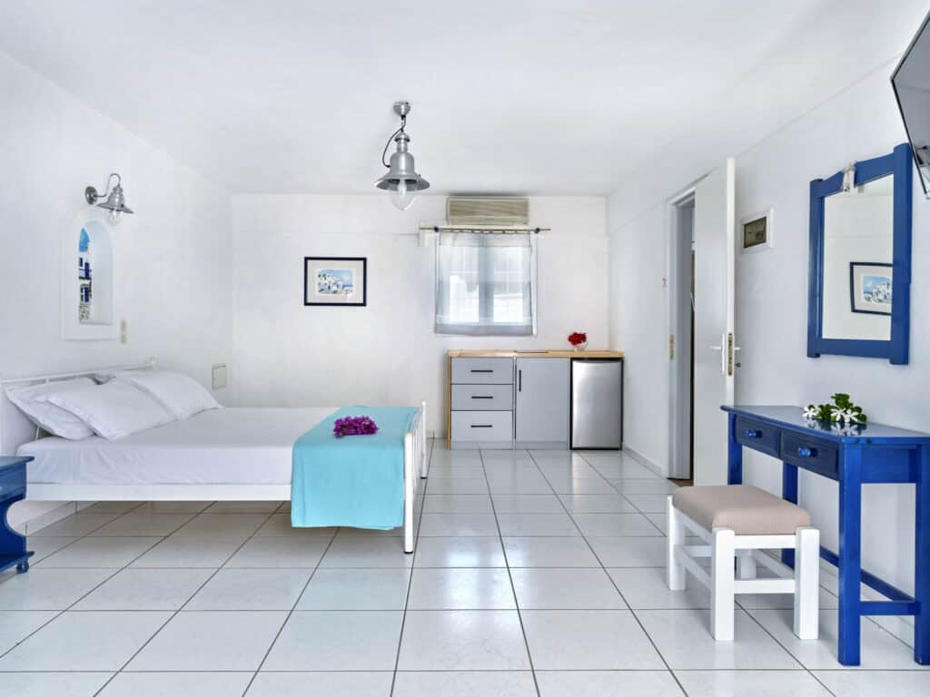 White & Blue Room dining and living area with natural light - Ambelas Paros sea-view rooms