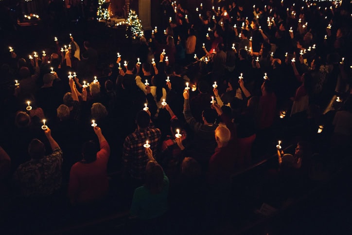 Easter candles lit during the Resurrection service on Holy Saturday in Paros
