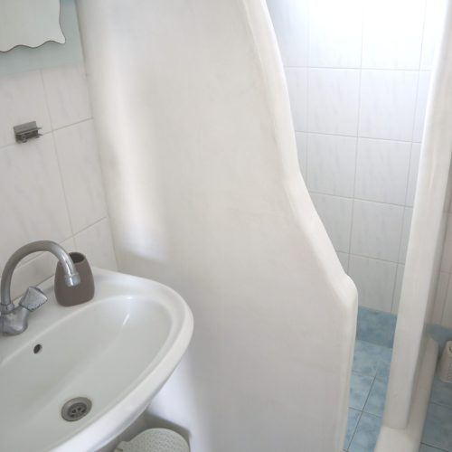 Clean bathroom with WC and sink - Aegean Grand Apartment Ambelas Paros