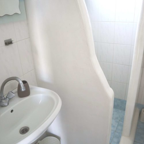 Clean bathroom with WC and sink - Aegean Grand Apartment Ambelas Paros