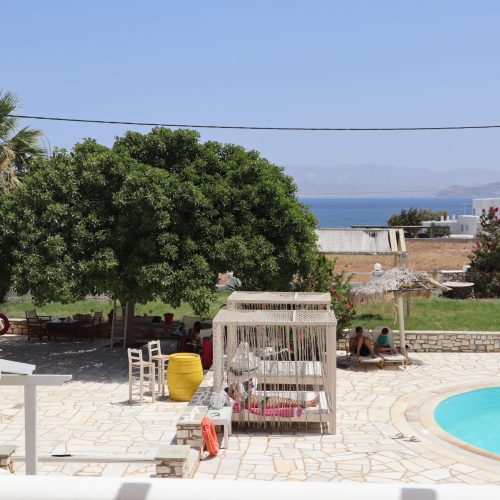 Outdoor dining area with sea view - Aegean Grand Apartment Ambelas Paros