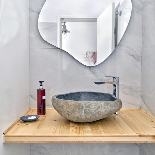 Modern bathroom with stone basin sink and mirror - Cozy Family Apartment Ambelas Paros