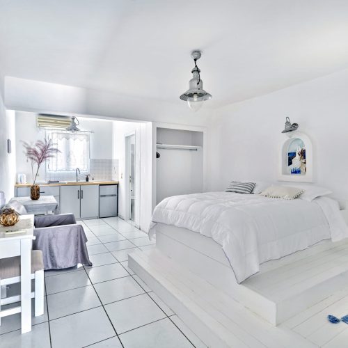 Bright bedroom with double bed and natural light - Cozy Family Apartment Ambelas Paros