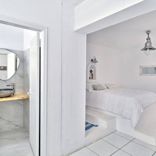 Bathroom with walk-in shower and stone sink - Cozy Family Apartment Ambelas Paros