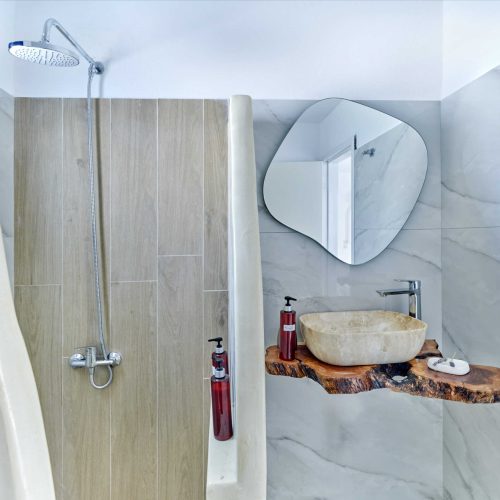 Modern bathroom with shower cabin and round mirror - Cozy Family Apartment Ambelas Paros