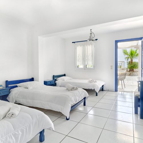 Cozy family apartment Ambelas Paros - three single beds in bright family bedroom