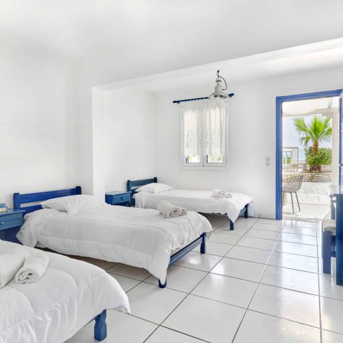 Cozy family apartment Ambelas Paros - three single beds in bright family bedroom