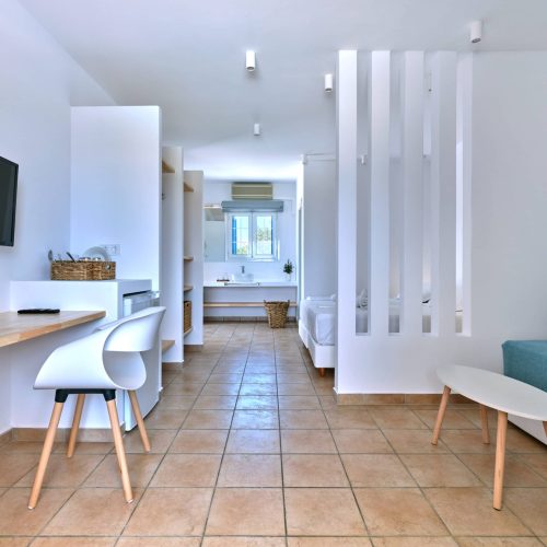 White & Blue room workspace and bedroom corner in Ambelas, Paros