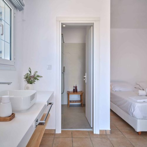 White & Blue room bathroom and bedroom connection in Ambelas, Paros