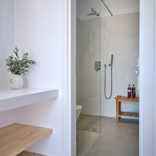 Bathroom shower of the White & Blue room with modern design in Paros
