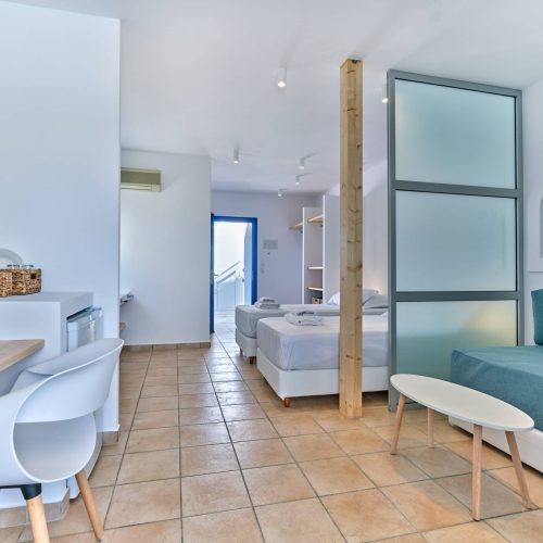 White & Blue room entrance and bedroom interior in Ambelas, Paros