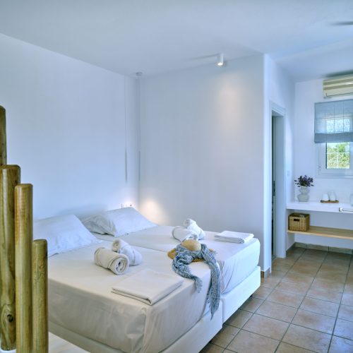 White & Blue room cozy bedroom with wooden divider in Ambelas, Paros