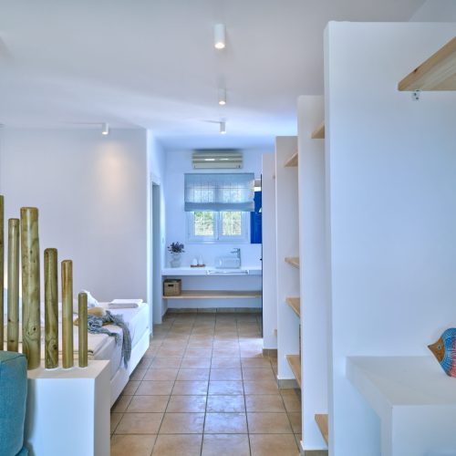 White & Blue room bedroom with Cycladic wooden panels in Paros island