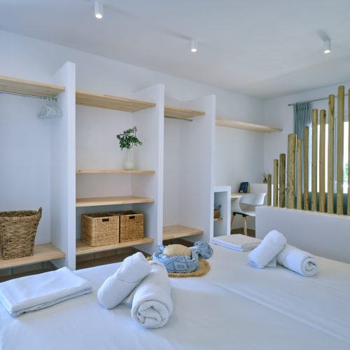 White & Blue room bedroom and sitting corner with decorative panels in Ambelas