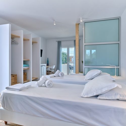 White & Blue room bedroom side view with soft tones in Ambelas, Paros