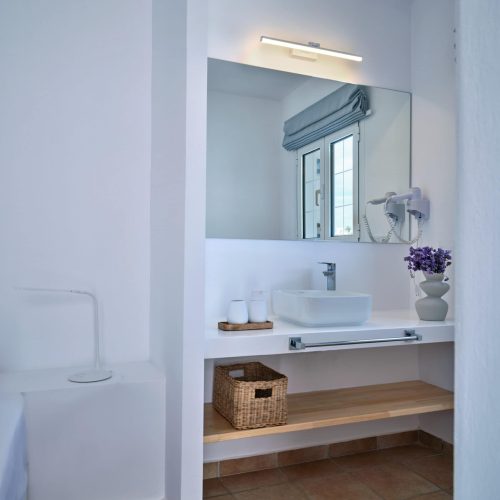 White & Blue room bathroom sink and mirror in Ambelas, Paros