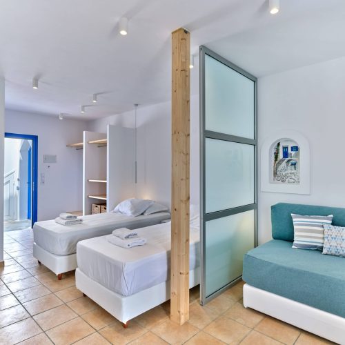 White & Blue room with Cycladic décor and seating area in Paros island