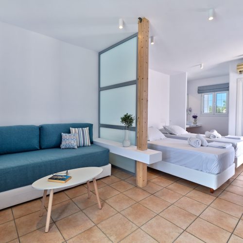 White & Blue room seating area and bedroom corner in Ambelas, Paros