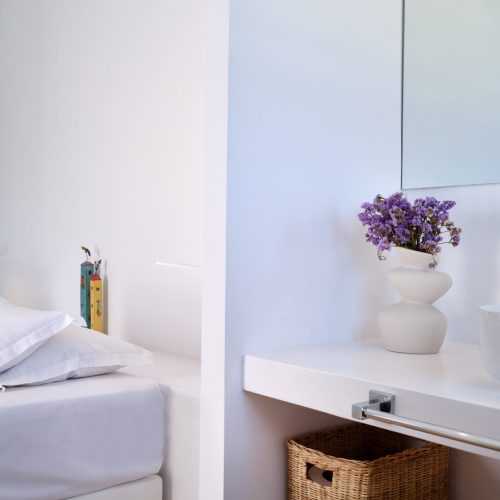 White & Blue room bathroom detail with sink and accessories in Paros island