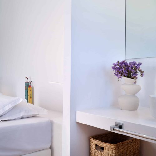 White & Blue room bathroom detail with sink and accessories in Paros island