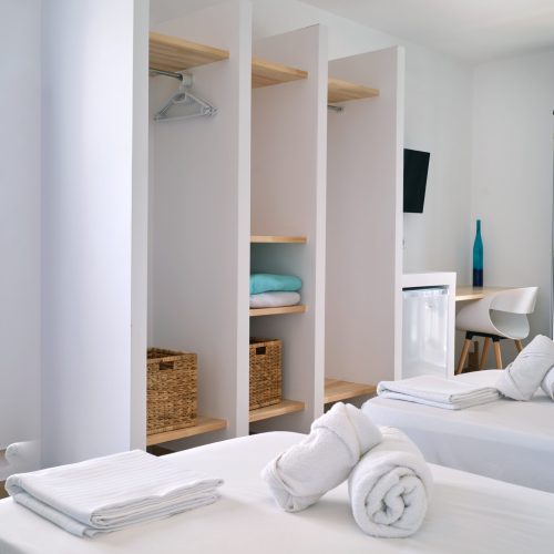White & Blue room bed detail with soft pillows in Ambelas, Paros