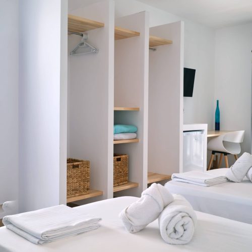 White & Blue room bed detail with soft pillows in Ambelas, Paros