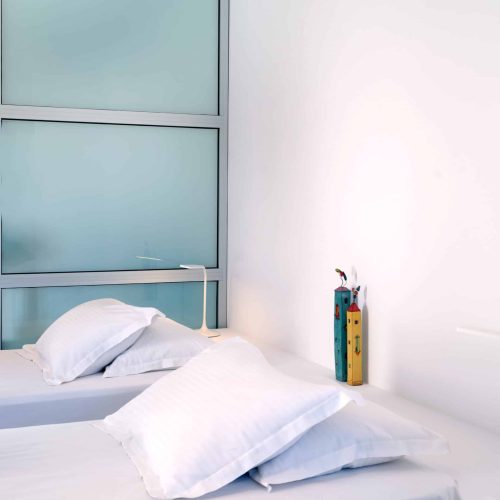 White & Blue room side-bed detail with Cycladic décor in Paros island