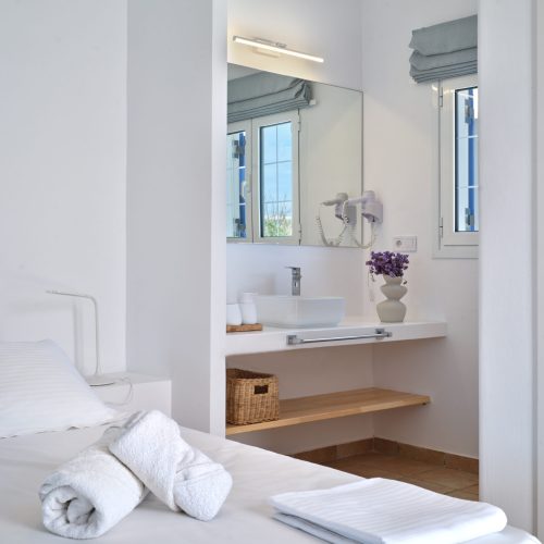 White & Blue room bathroom and bedroom connecting view in Paros island