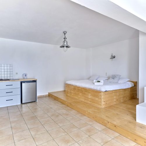 Bright White & Blue Room kitchenette and dining area - sea-view accommodation in Ambelas Paros