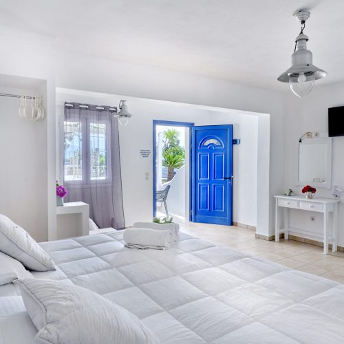 White & Blue Room bedroom with natural décor and soft lighting - Ambelas Paros hotel room