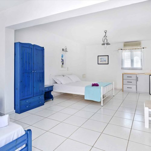 Bright White & Blue Room with two beds and open-plan layout - family accommodation in Ambelas Paros