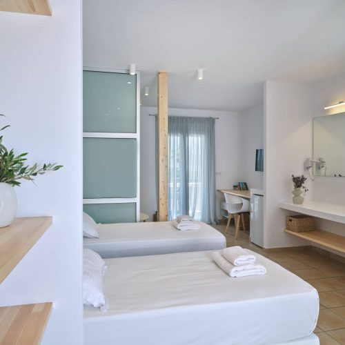 White & Blue room bedroom interior with soft lighting in Paros island