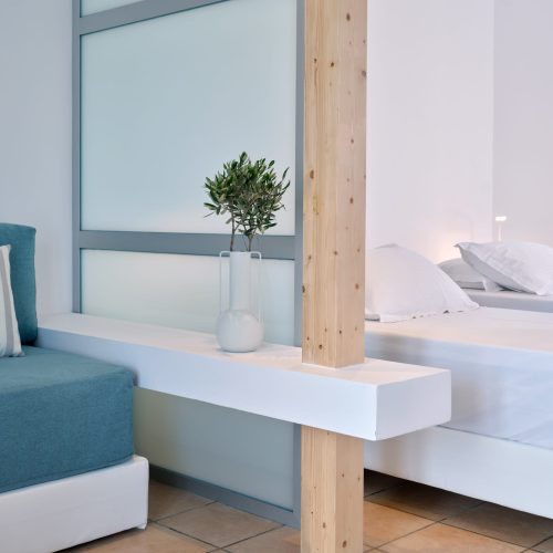 White & Blue room bed and wooden design elements in Ambelas, Paros